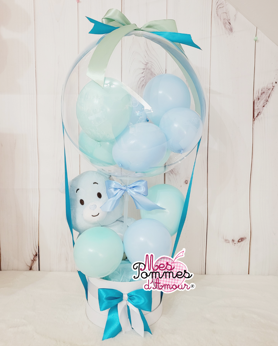 Comment faire une montgolfière avec des ballons et une peluche